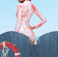 Load image into Gallery viewer, UPF Rashguard Neon Coral Palms surfsuit on cream white swimsuit sun-kissed bright orange palm leaves beach pool surf swim women modest