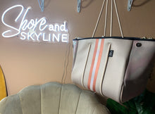 Load image into Gallery viewer, © Sahara Pearl waterproof tote & crossbody sand beige premium neoprene + pearlescent & sunset rose-gold stripes & champagne mirage interior holiday gift ShoreAndSkyline