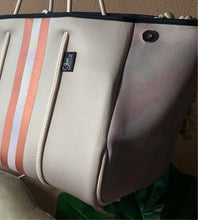 Load image into Gallery viewer, © Sahara Pearl waterproof tote & crossbody sand beige premium neoprene + pearlescent & sunset rose-gold stripes & champagne mirage interior holiday gift ShoreAndSkyline