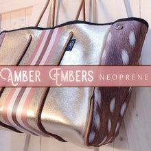 Load image into Gallery viewer, NWT © Amber Embers smooth blushed bronze lit metallic neoprene TOTE w auburn fawn snap sides + rouged amber &amp; chocolate brown racing stripes
